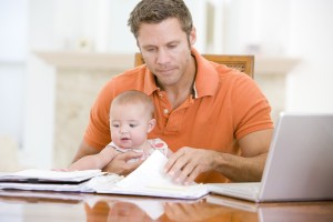 Man working from home with baby